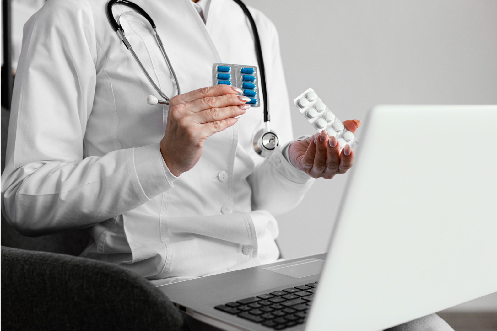 Doctor with laptop and medicine